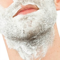 man with shaving cream on face